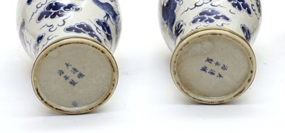 Lot 139 - Two pairs of Chinese blue and white moon flasks