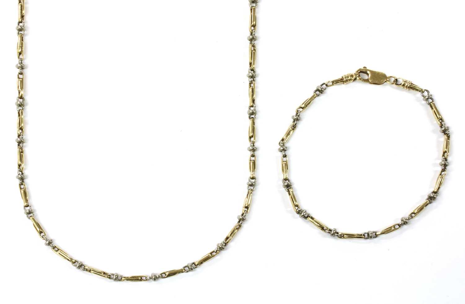 Lot 67 - A 9ct two colour gold necklace and bracelet suite