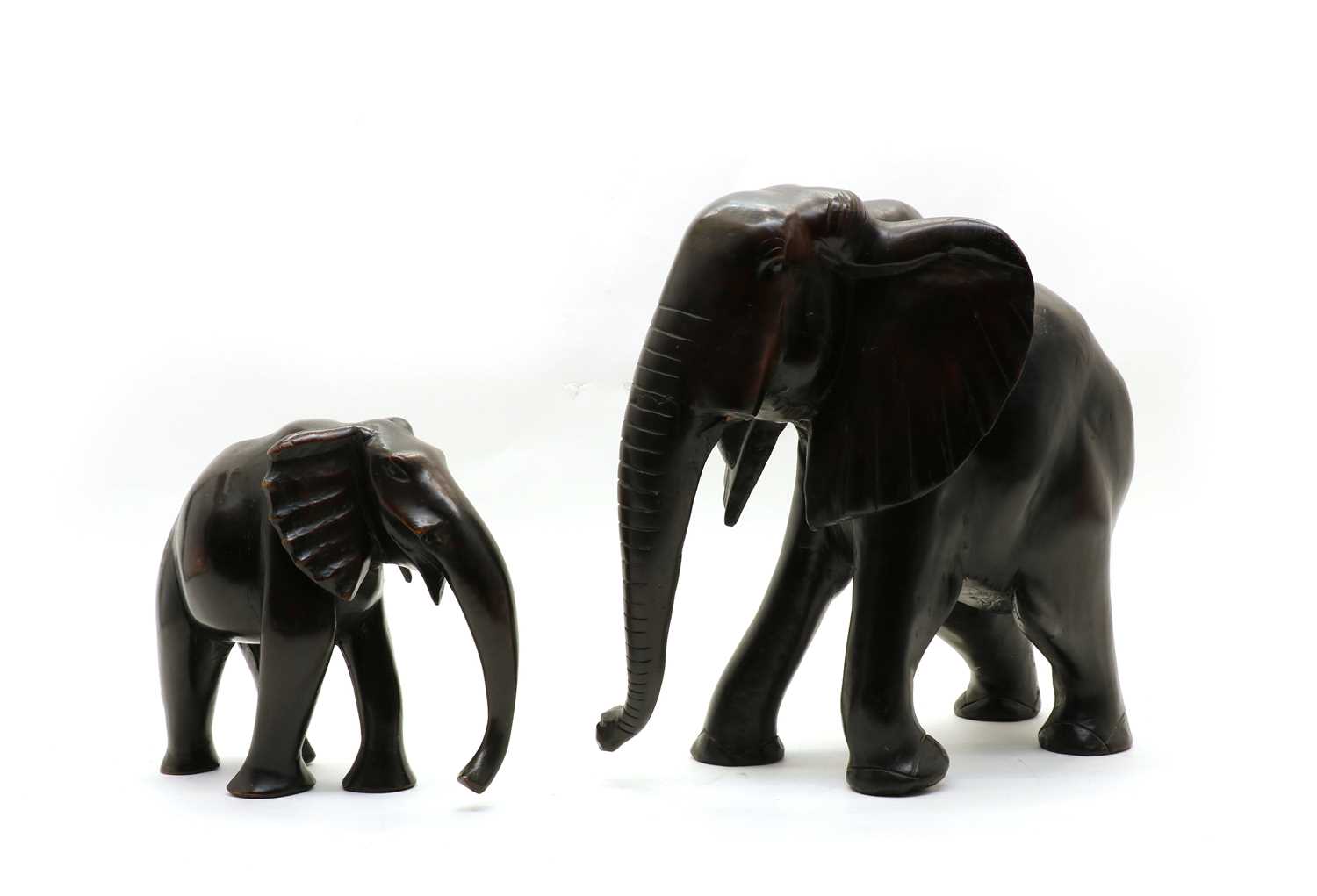 Lot 120 - Two carved hardwood elephants