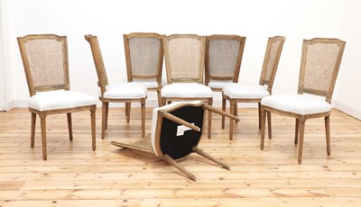 Lot 424 - A set of eight modern bleached oak dining chairs