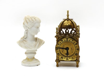Lot 175 - A brass lantern clock