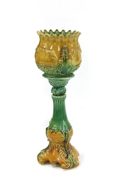 Lot 121 - A Victorian majolica jardiniere and stand