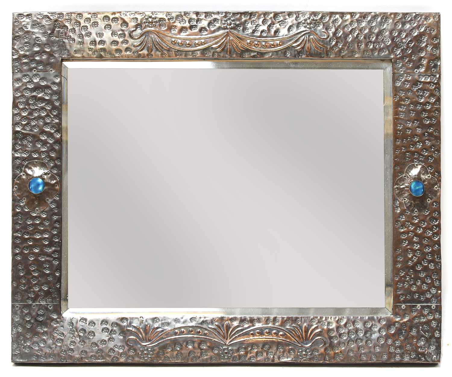 Lot 69 - An Arts and Crafts embossed copper mirror