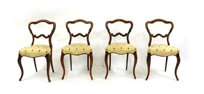 Lot 289 - A set of four William IV rosewood balloon back chairs