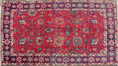 Lot 239 - A Persian Tabriz rug