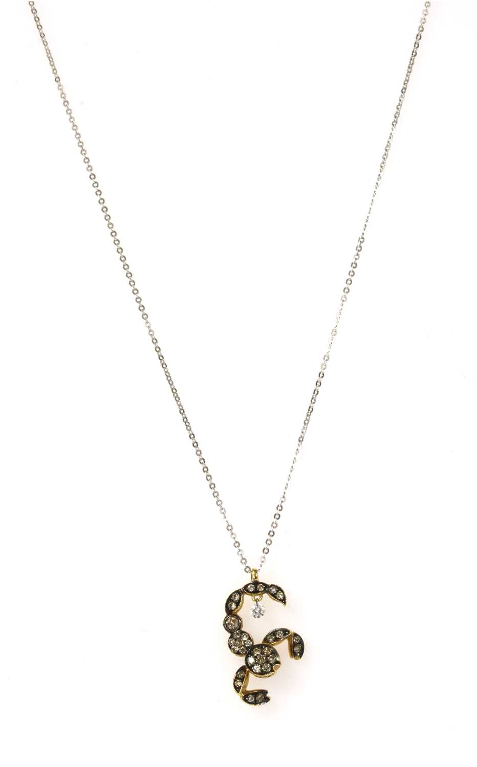 Lot 101 - An 18ct gold diamond set Scorpio pendant
