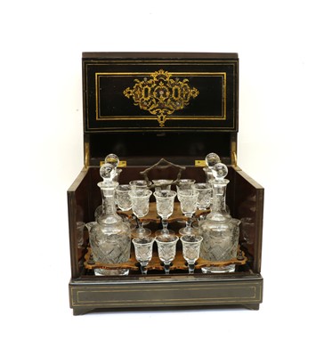 Lot 152 - A 19th century French brass strung ebonised cased liqueur set