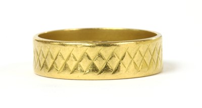 Lot 54 - A 22ct gold diamond cut flat section wedding ring