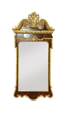 Lot 229 - A pair of modern George I revival parcel gilt and walnut mirrors (2)