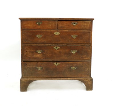 Lot 602 - A George III oak chest of drawers