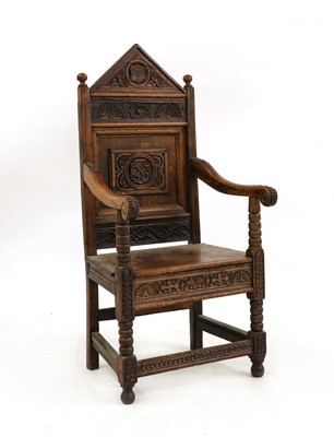 Lot 403 - An oak throne chair