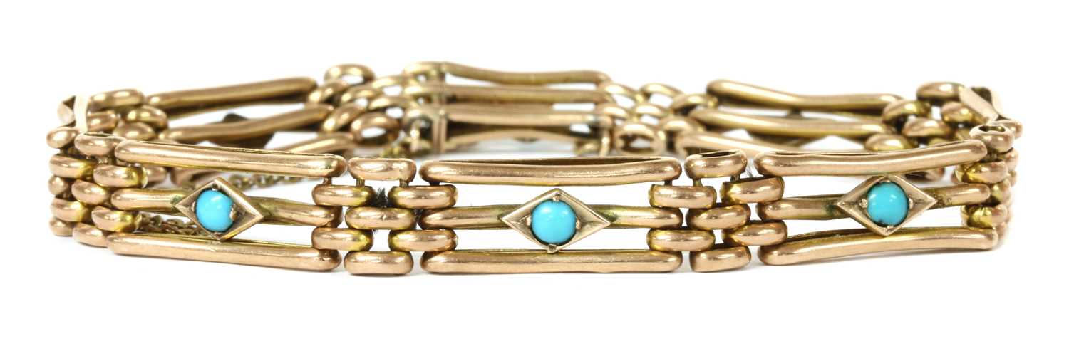 Lot 17 - An Edwardian gold turquoise set gate bracelet