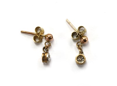 Lot 11 - A pair of Edwardian gold diamond drop earrings