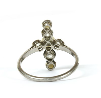 Lot 13 - A platinum pearl and diamond ring