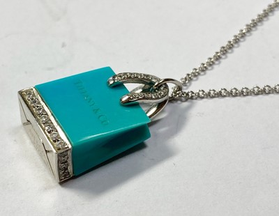 Lot 202 - A platinum turquoise and diamond shopping bag pendant/charm by Tiffany & Co.