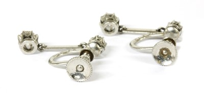 Lot 12 - A pair of early 20th century diamond drop earrings