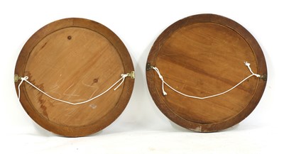 Lot 84 - A pair of Arts and Crafts circular oak wall mirrors