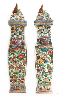 Lot 37 - A pair of Chinese famille rose vases and covers