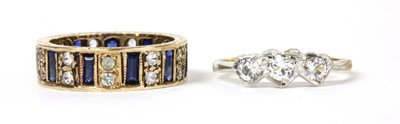 Lot 236 - A 9ct gold blue and white paste full eternity ring