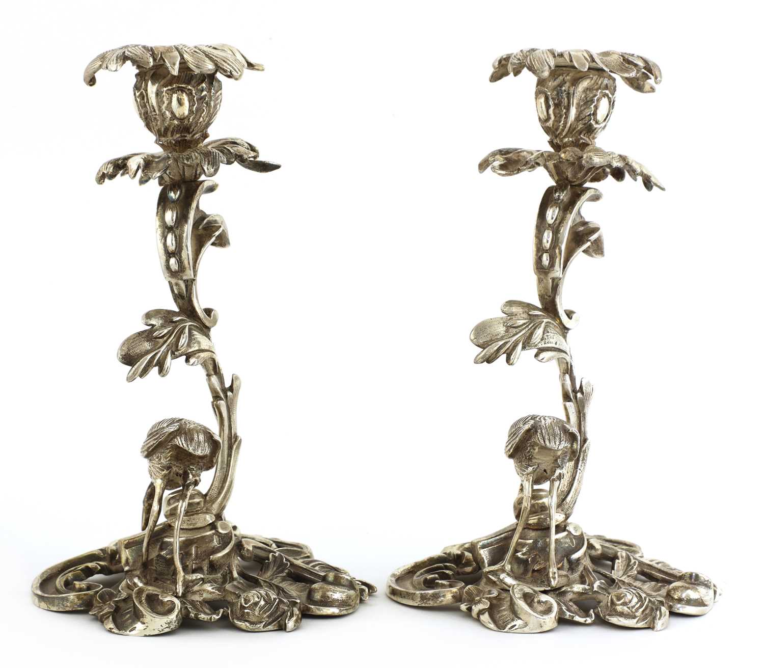 Lot 509 - A pair of cast silver-plated candlesticks