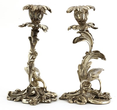 Lot 509 - A pair of cast silver-plated candlesticks