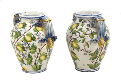 Lot 695 - A pair of large tin-glazed earthenware jars