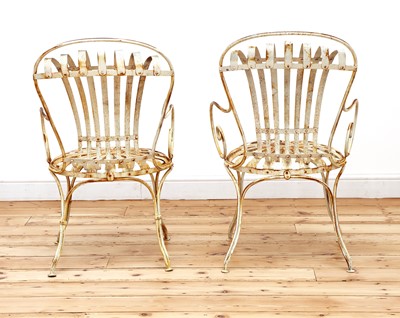 Lot 851 - A pair of François Carré 'Sunburst' garden chairs