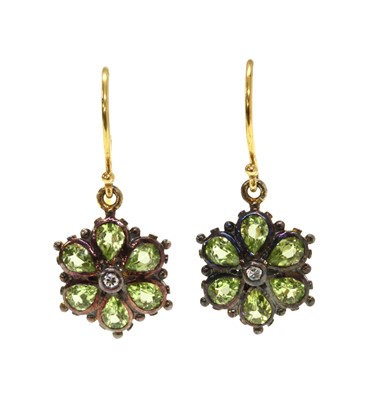Lot 153 - A pair of silver and gold peridot floral cluster earrings