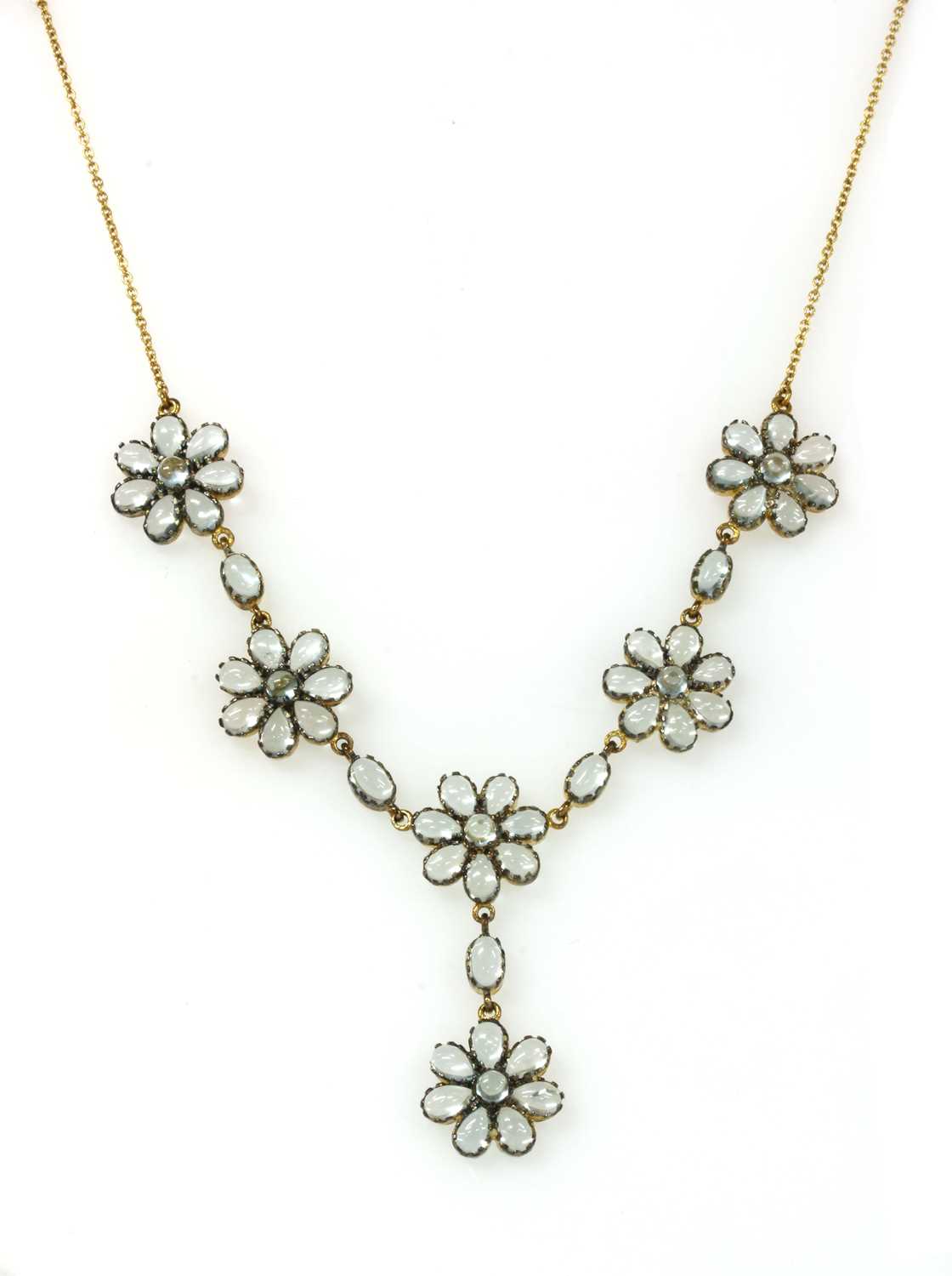 Lot 185 - A silver and gold, blue topaz necklace