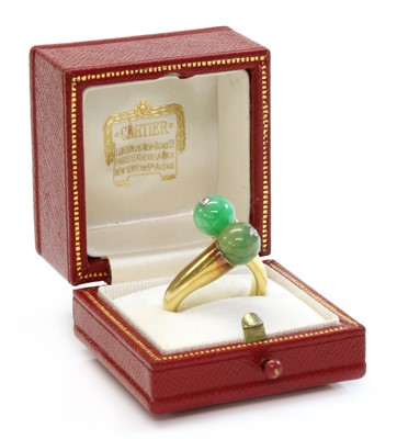 Lot 186 - A two stone jade bead and diamond crossover ring, by Cartier