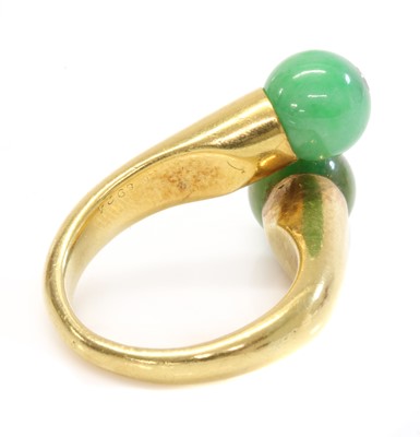 Lot 186 - A two stone jade bead and diamond crossover ring, by Cartier