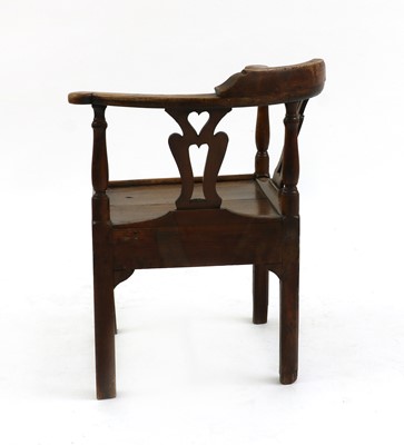 Lot 406 - An 18th/19th century oak corner chair