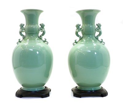 Lot 153 - A pair of Chinese celadon vases