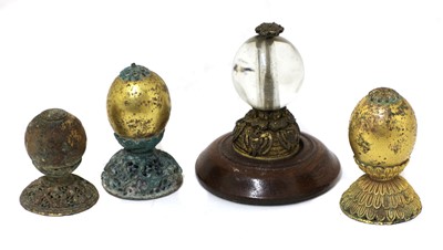Lot 324 - A collection of four Chinese hat finials