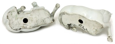 Lot 55 - A pair of Chinese white-glazed horses