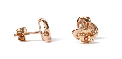 Lot 256 - A pair of silver rose gilt diamond set stud earrings