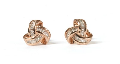 Lot 256 - A pair of silver rose gilt diamond set stud earrings