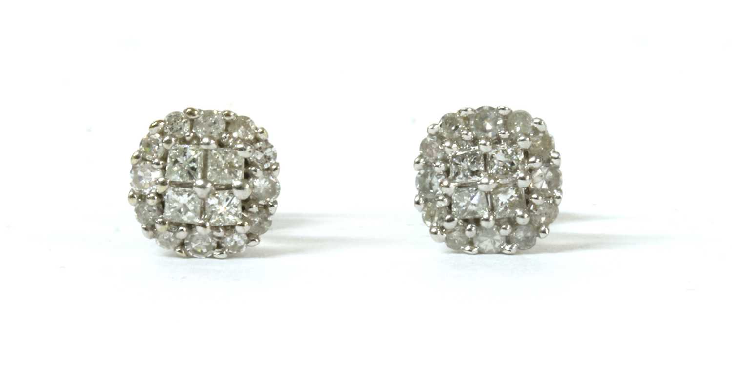 Lot 115 - A pair of white gold diamond cluster earrings