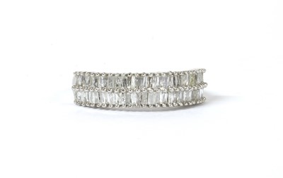 Lot 254 - A silver two row diamond eternity ring