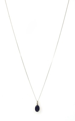 Lot 168 - A white gold single stone sapphire pendant