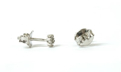 Lot 126 - A pair of white gold diamond cluster stud earrings