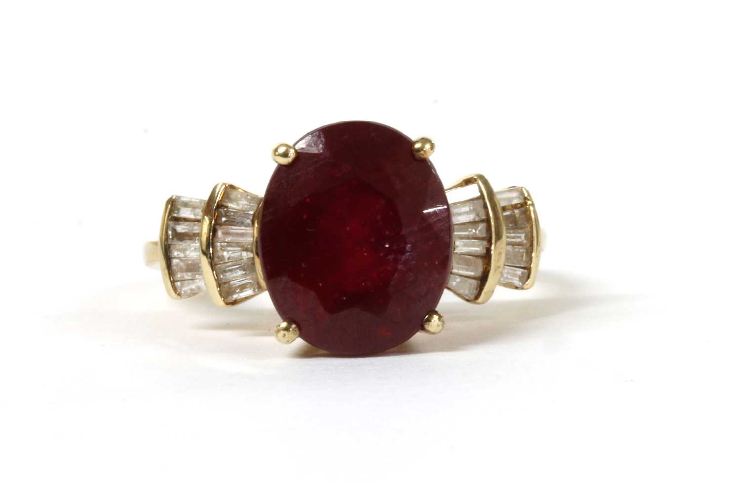 Lot 142 - A gold fracture filled ruby and diamond ring