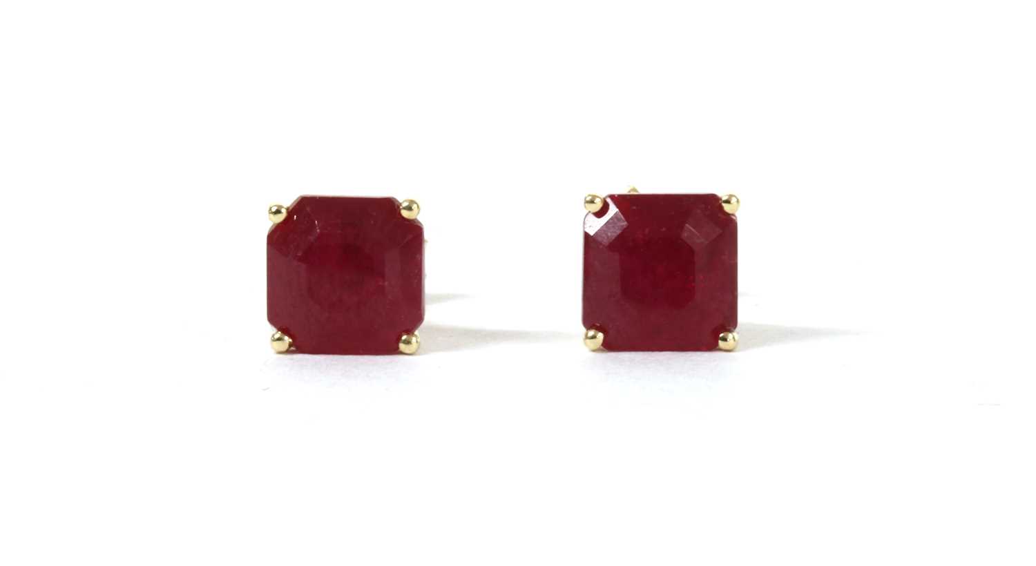 Lot 146 - A pair of gold single stone fracture filled ruby stud earrings