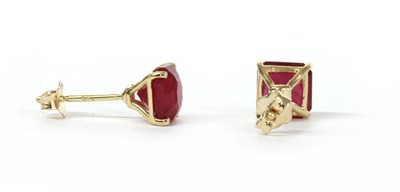 Lot 146 - A pair of gold single stone fracture filled ruby stud earrings