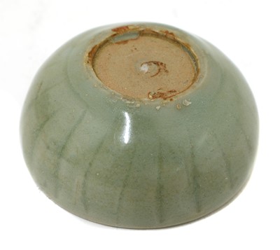 Lot 7 - A Chinese celadon-glazed teacup