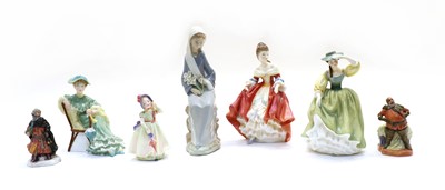 Lot 323 - A collection of ceramic figures