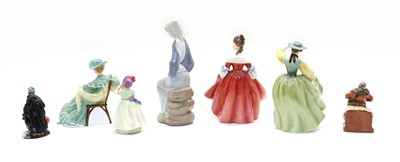 Lot 323 - A collection of ceramic figures