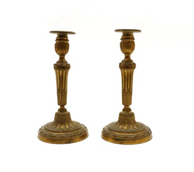 Lot 214 - A pair of 19th Century French Empire candlesticks