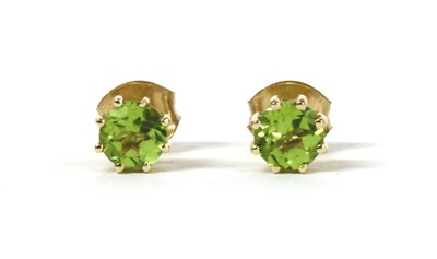 Lot 191 - A pair of gold single stone peridot stud earrings