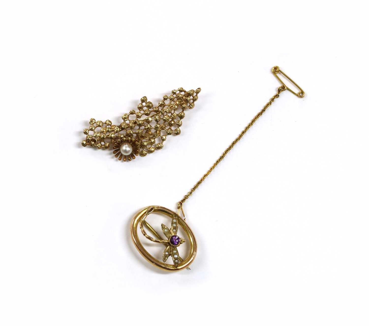 Lot 20 - An Edwardian gold amethyst and split pearl dragonfly brooch